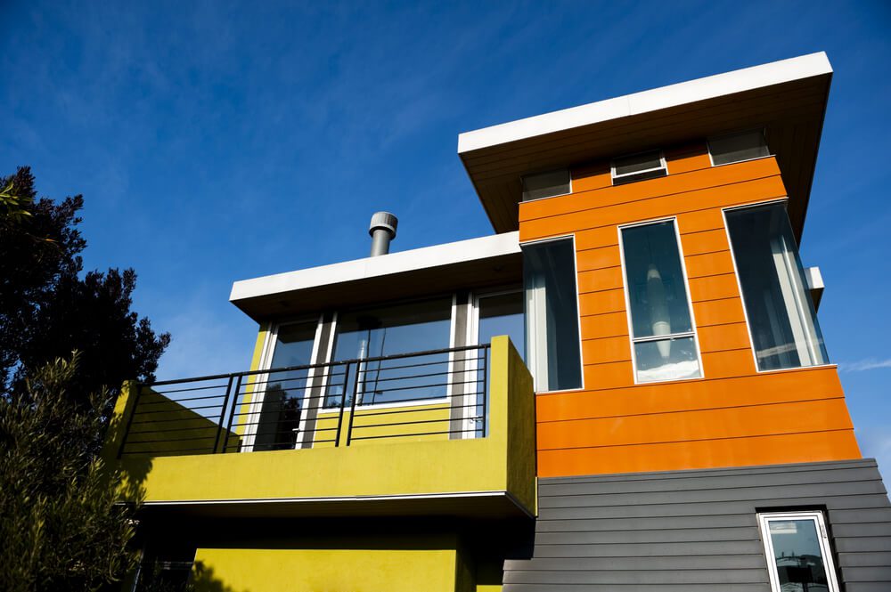 Image of an orange and yellow modular home built by a contractor after getting a modular home loan
